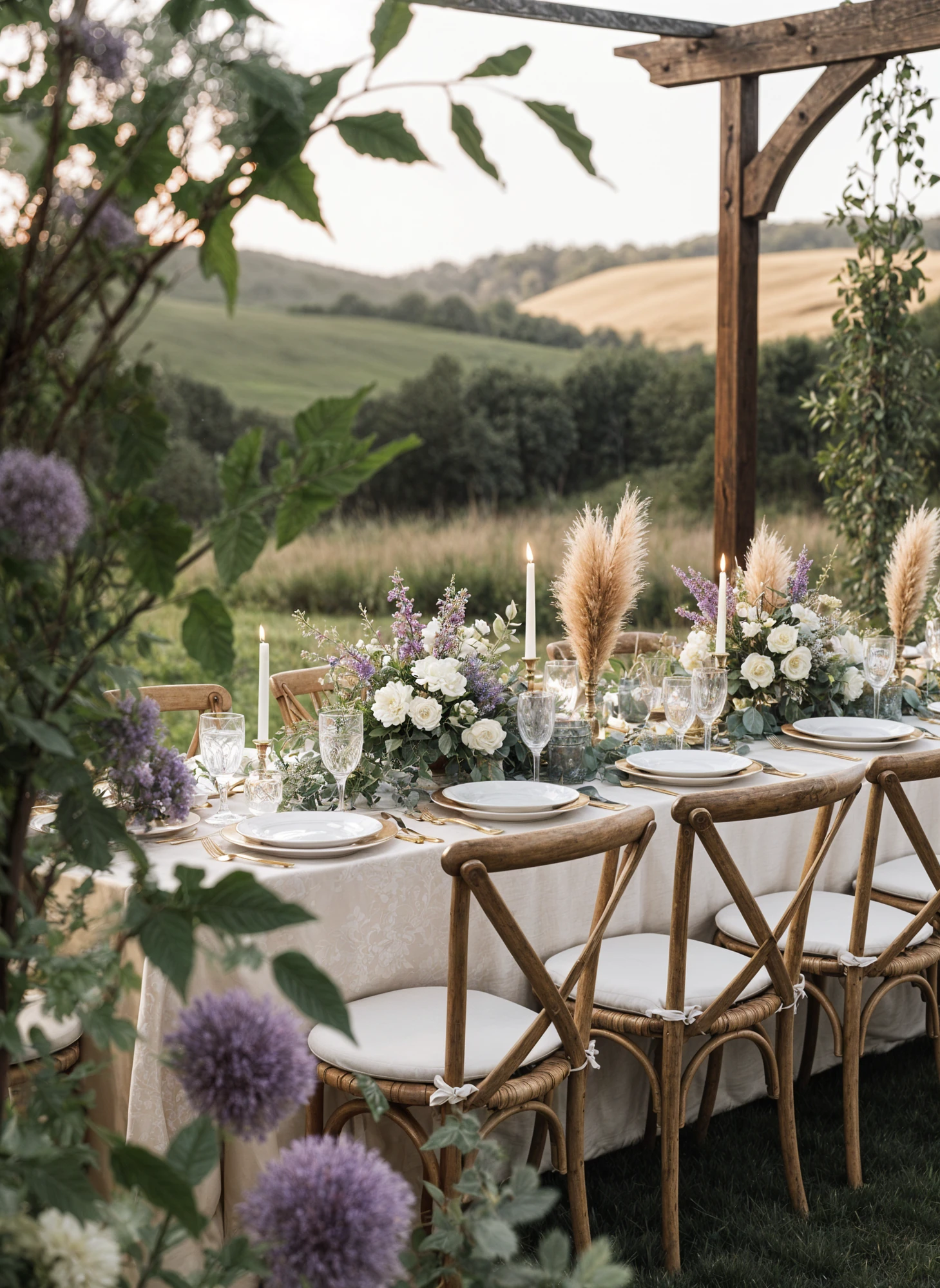 Wedding Tablescape With Purple Floral Centerpieces, Light Blue Linens, and Wooden Chairs