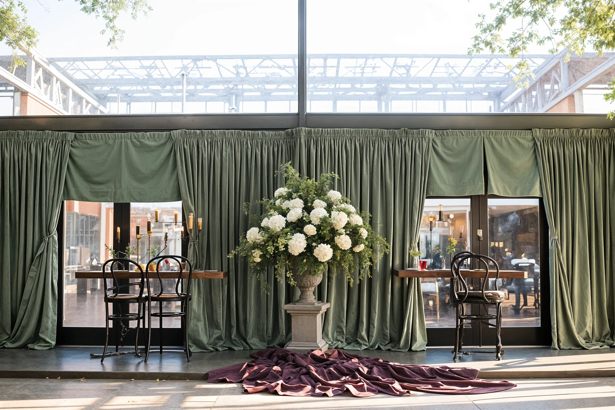 Green curtains with large white flower vase in center at wedding reception 