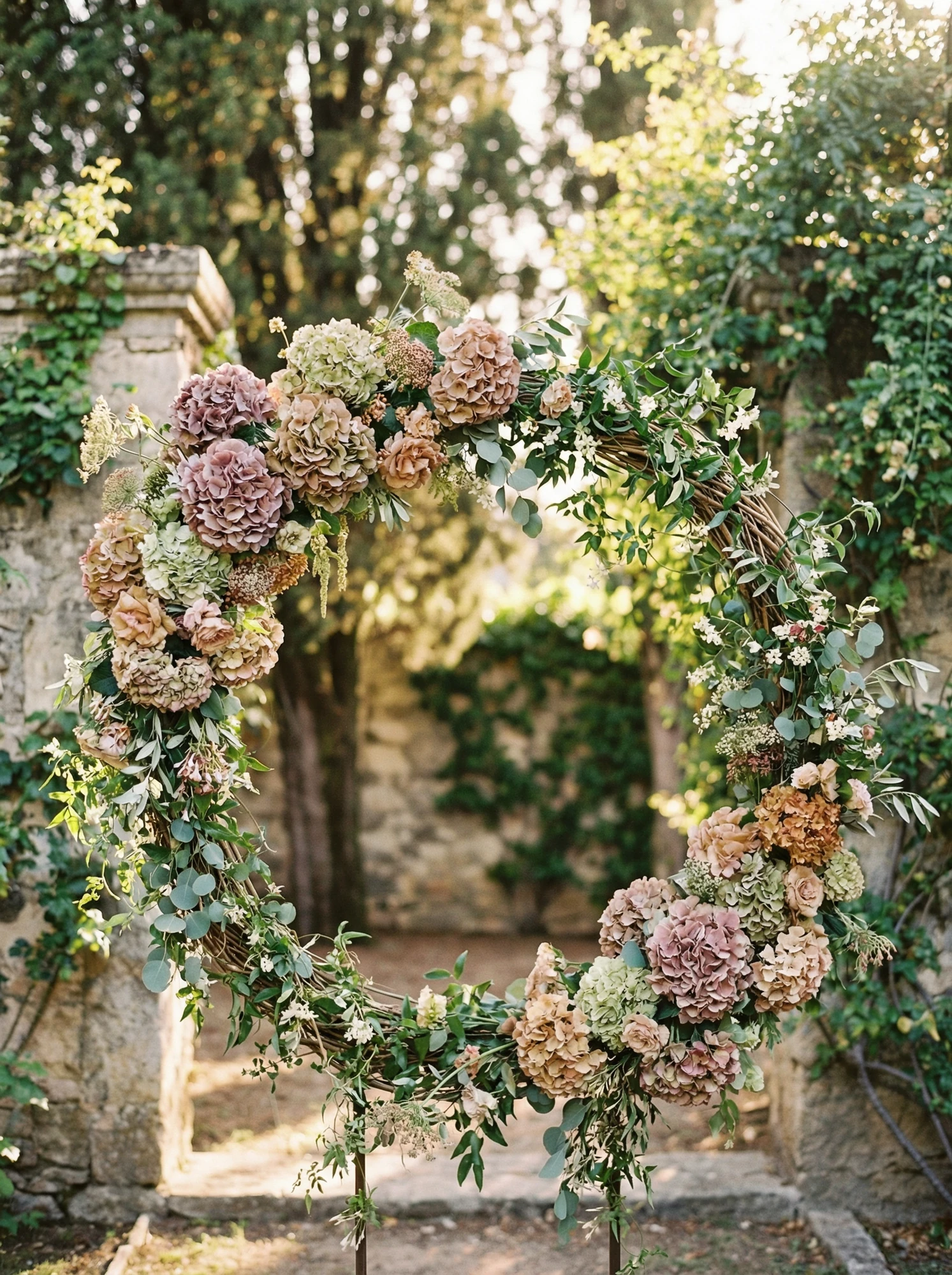 wedding floral arch with hydrangeas and greenery